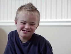 Downs boys looking into camera smiling. Stock Footage