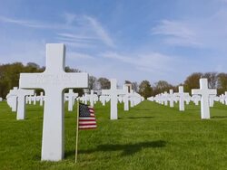 WS LA View of American war cemetery site and country flag / Sandweiler, Luxembourg Stock Footage