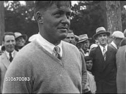 1926: WINNING THE DOUBLE: HA WS Golf course w/ people gallery walking forward, MS U.S. Amateur golfer Bobby Jones w/ people standing BG, HA XWS Bobby putting on unidentified course green, sinking shot.  Possibly St. Andrews, or Scioto Country Club Instructional Video