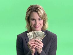 CU, Businesswoman holding fan of American dollar banknotes in studio, portrait Stock Footage