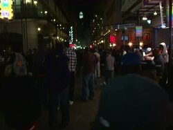 Medium Shot Pan Left - Bourbon Street crowds at night / New Orleans Louisiana Stock Footage