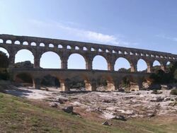 MS People walking on bridge / Vers-Pont-du-Gard, Provence ,France Stock Footage