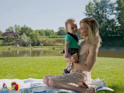 LS Mother And Baby Relaxing In The Park Stock Footage