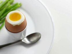  CU PAN Shot of asparagus dipped in boiled egg / London, United Kingdom  Stock Footage