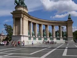 Budapest, tourists walking in Hosok Tere (Heroes Square) Millennium Monument Stock Footage