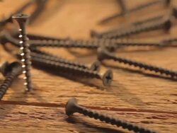 CU PAN Revealing three screws being unscrewing  / Los Angeles, California, United States Stock Footage