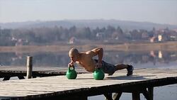 Push-ups by the lake Stock Footage