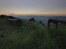 Crane shot of sunset view from hilltop vantage point Stock Footage