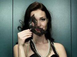 Young woman holding masquerade mask Stock Footage