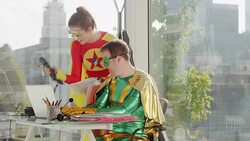 Superheroes working in office Stock Footage