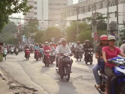 MS Main street of Ho Chi Minh City crowded with motorcycles / Quan Binh Thanh, Ho Chi Minh, Vietnam Stock Footage