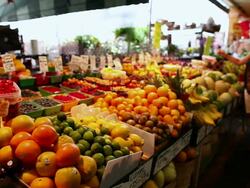 MS PAN Shot of lady shopping at French fruit and vegetable stand in atwater market / Montreal, Quebec, Canada Stock Footage