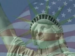 Statue of Liberty and US Flag Behind Stock Footage