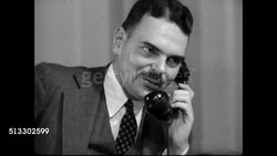 1937: THOMAS E. DEWEY: LA WS Woolworth Building, archway FG. INT VS New York City Criminal prosecutor Thomas E. Dewey (1902-1971) at desk on telephone. WS Men looking at books, papers. CU Filing cabinet, files. Evidence, research, investigation. NYC Instructional Video