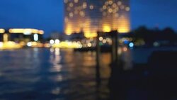 Bokeh of cityscape along river Stock Footage