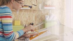 Architect drawing blueprint in office Stock Footage