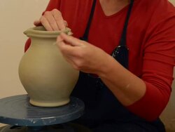 MS Shot of female potter makes a handle to pitcher / Landshut, Bavaria, Germany Stock Footage