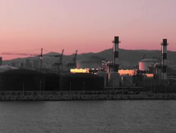 Ship leaving the harbor at sunset Stock Footage