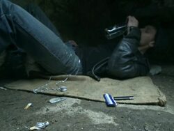 HD DOLLY: Homeless Young Man Drinking Alcohol Stock Footage