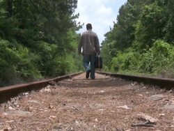 Man walking down the tracks HD Stock Footage