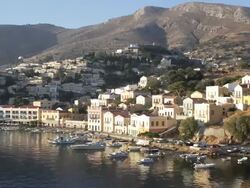 Symi, Greece. Timelapse of sun rising in harbour Stock Footage