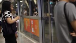 Crowded people in the mass public transportation using their phone while waiting Stock Footage