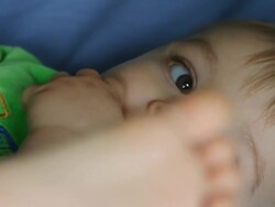 Baby playing with his feet Stock Footage