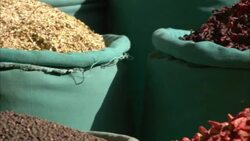 Herbs and spices fill colorful baskets at a spice market in Egypt. Stock Footage