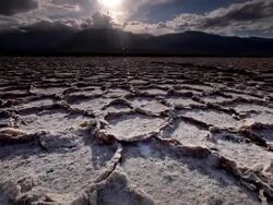 WS LA POV Dry Cracked Earth and Salt Flats / Death Valley NP, California, United States  Stock Footage
