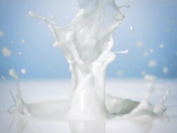 HD Super Slow-Mo: Strawberry Splashing Into Milk Stock Footage