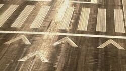 Aircraft point of view of markings on landing strip tarmac. Stock Footage