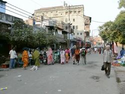 MS People walking on street and vegetable vendors / Varanasi, Utter Pradesh, India  Stock Footage
