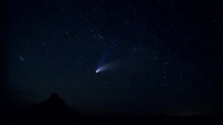 A comet descends on the horizon as night falls onto the desert. Stock Footage