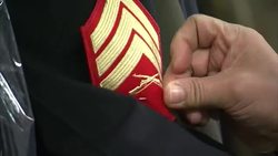 Tailor Sewing Patch Onto Military Dress Uniform News Clip