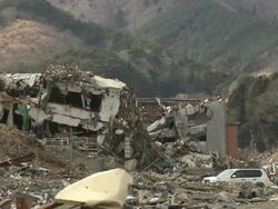 Destruction in Onagawa city, near Sendai Japan on 3rd April 2011; after tsunami following Tohuku earthquake of March 2011. Stock Footage