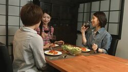 Three young women preparing food in the kitchen Stock Footage