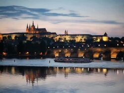 St. Vitus Cathedral, Charles Bridge and the Castle District illuminated at night,  Prague, Czech Republic Stock Footage