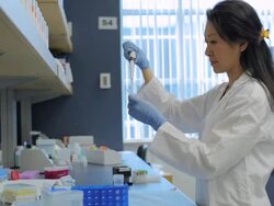 MS POV Female technician using micro-pipette at research center / Vancouver, BC, Canada Stock Footage