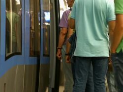 Commuters Boarding Subway Train (4K/UHD to HD) Stock Footage