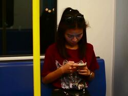 HD:Young woman use smartphone on the train. Stock Footage