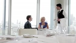 Waiter taking business people's order in restaurant Stock Footage