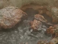 CU Boiling water and steam rising from ground in Krysuvik Geothermal area / Reykjanes peninsula, Iceland      Stock Footage