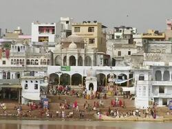 WS People bathing near river shore / Pushkar, Rajasthan, India Stock Footage