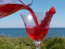 CU Shot of raspberry cocktail pouring in glass / Spain Stock Footage