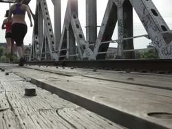 MS Two young girls running and exercising together on railway track / Minneapolis, Minnesota, United States Stock Footage