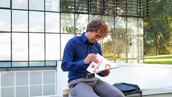 Multi tasking in office park Stock Footage