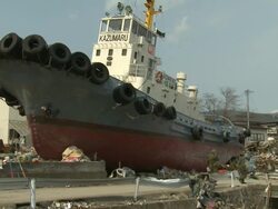 Destruction in Ofunato city, Iwate, Japan on 2nd April 2011; after tsunami following Tohuku earthquake of March 2011.  The tsunami wave reached approx 23 metres high and continued inland for 3 kilometers.  Stranded Ship Stock Footage