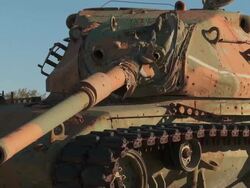 MS Broken down tank in the desert Stock Footage