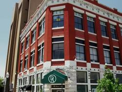 Tilt up beautiful old brick hotel Stock Footage