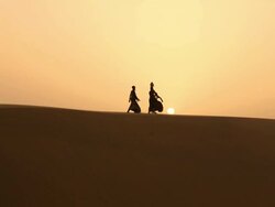 Rajasthani people walking on desert, Sam Desert, Jaisalmer, Rajasthan, India Stock Footage